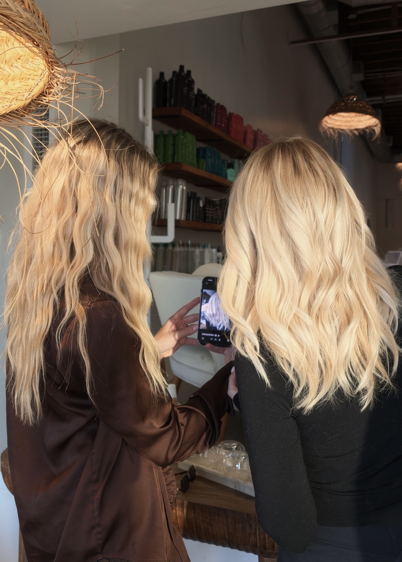 Liwia and Jonna reviewing blonde hair content together at the salon
